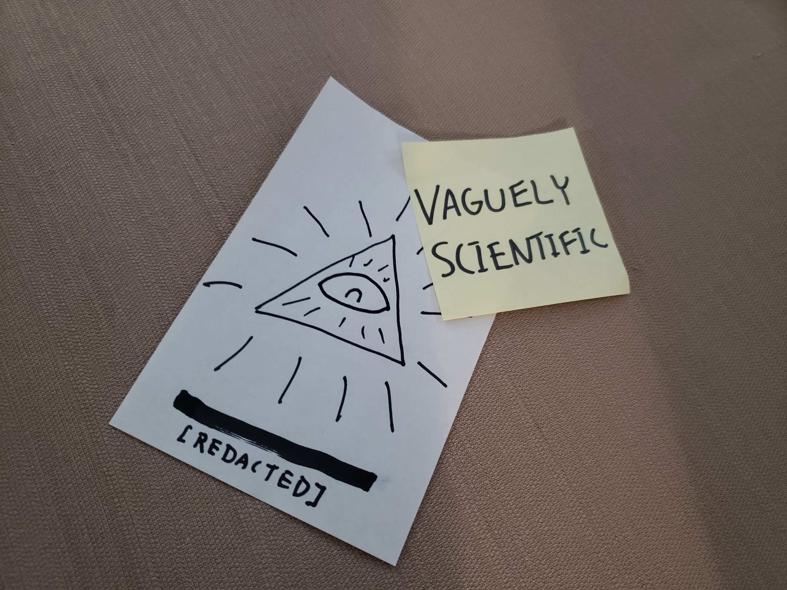 The Illuminati's business card with the Vaguely Scientific logo attached.